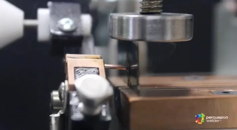 Wire positioned at the clamp and copper block of the bench fixture