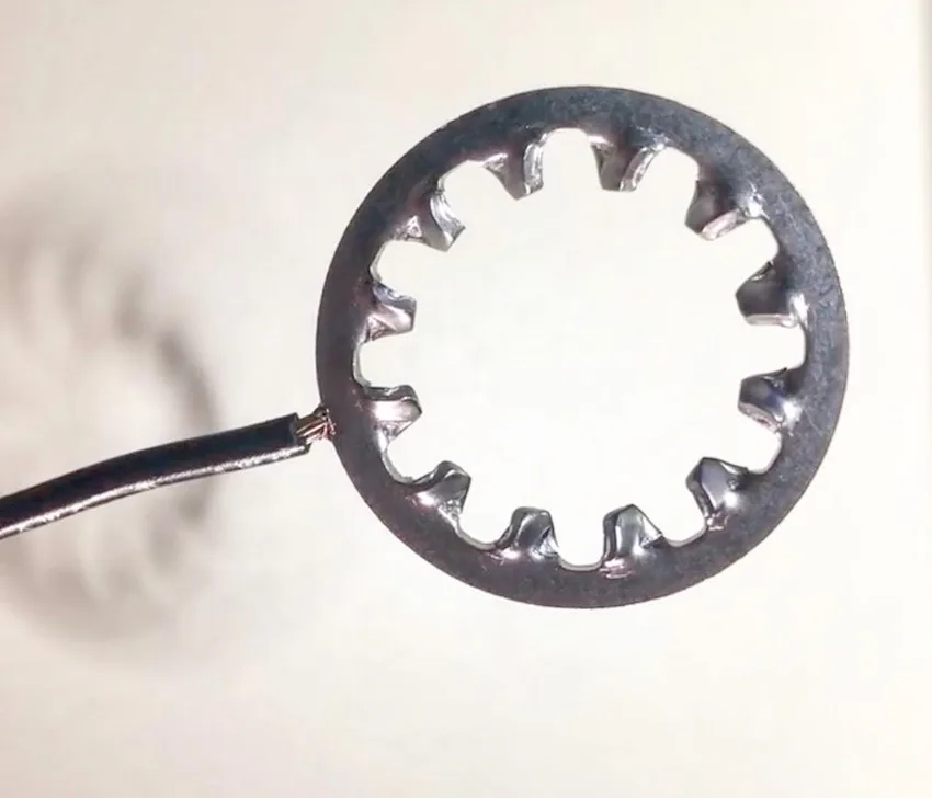 Wire percussion welded to a lock washer
